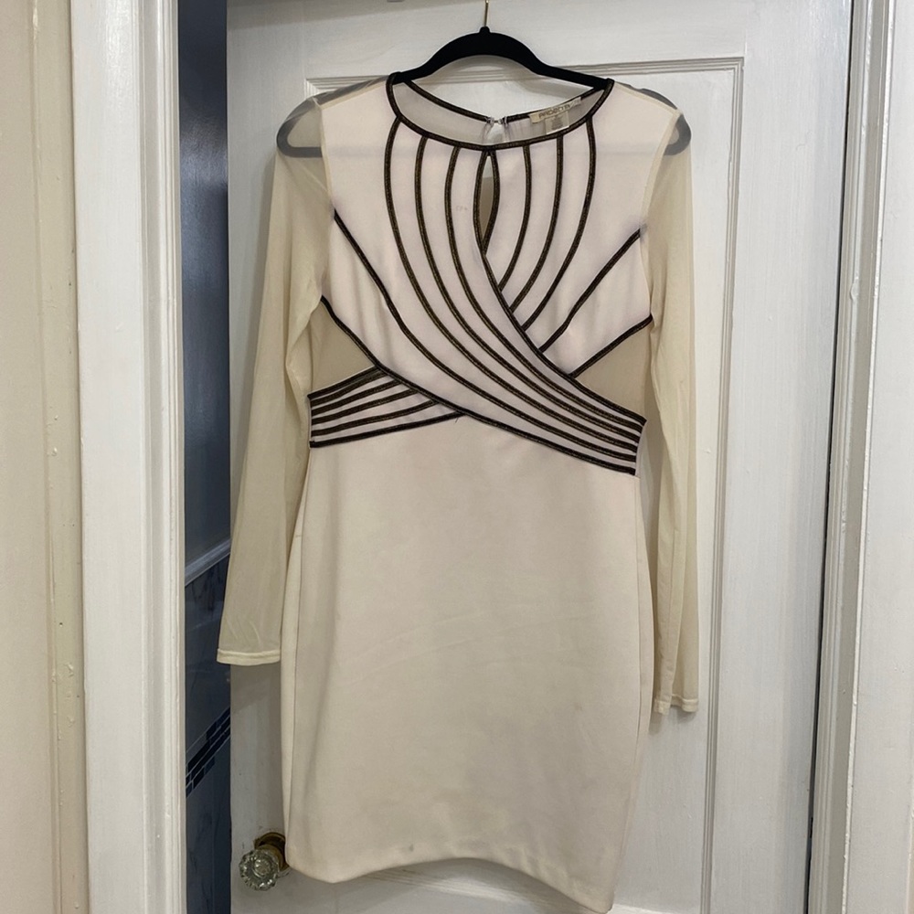 Medium cream dress. Very good stretch contours body perfect.
